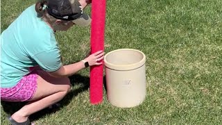 Stick a pool noodle into a planter for this brilliant front porch idea!