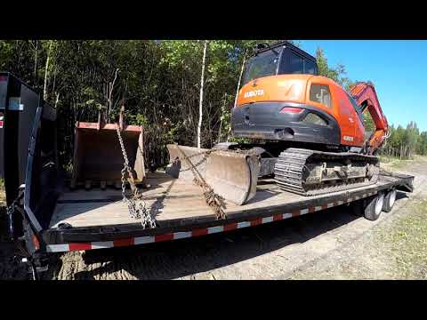 Part of a video titled How to load an excavator on your trailer safely - YouTube