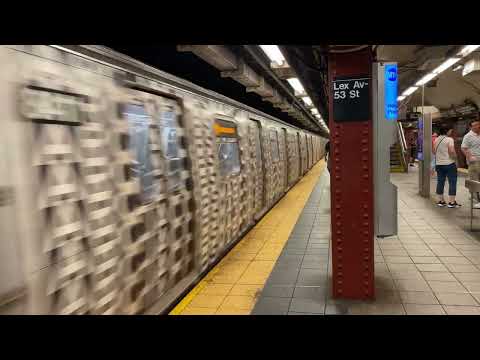 Forest Hills bound Marc Jacobs Ad-Wrapped R160 (M) train departing Lexington Ave - 63 St