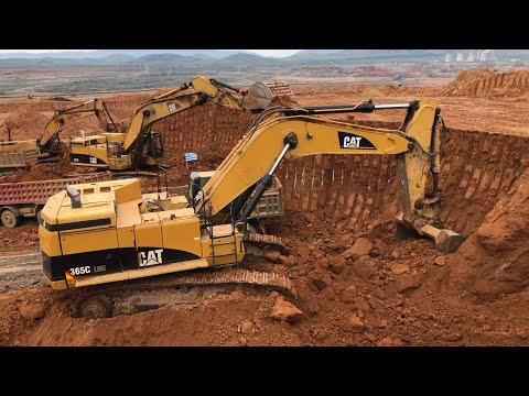 Two Caterpillar 365C Excavators And Caterpillar 245B Loading Trucks