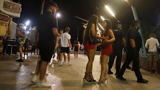video: Magaluf residents' fury as drunk British holidaymakers 'wear no masks' and 'jump on cars'