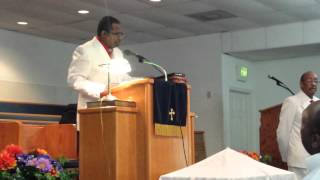 Pastor singing Yes God Is Real