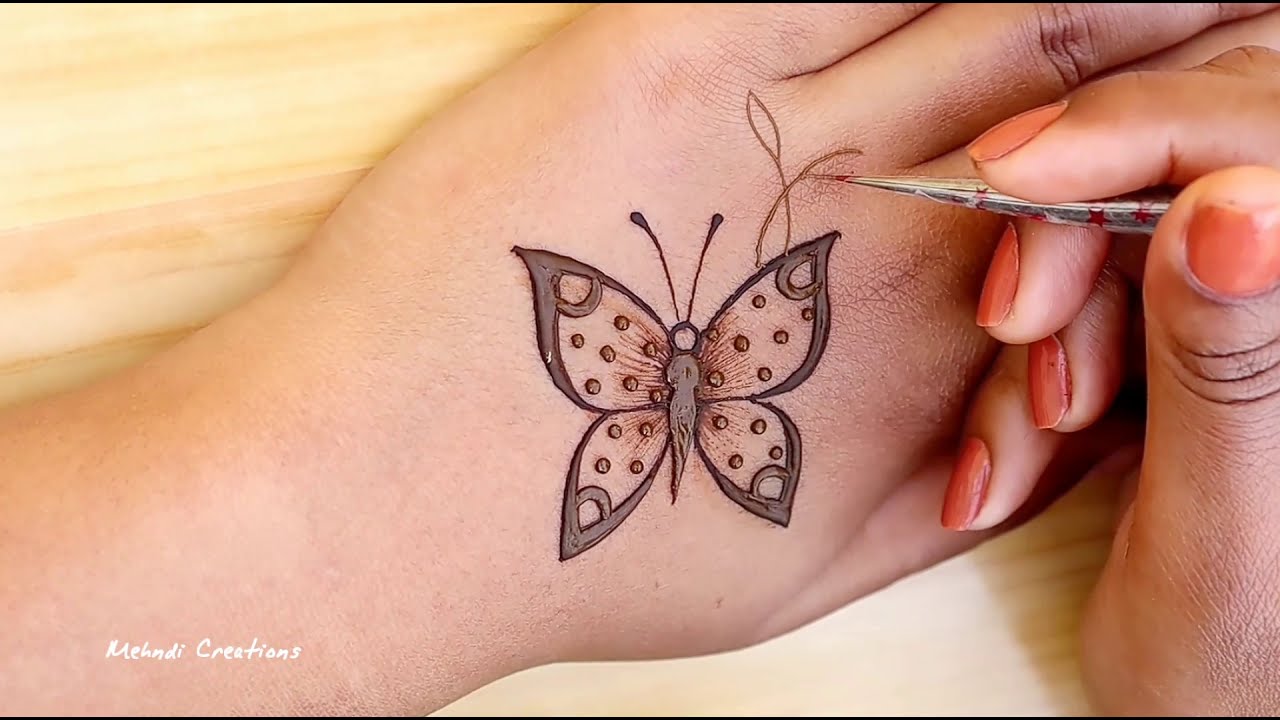 awesome butterfly mehndi design for back hand by mehndi creations