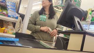 Dollar Tree cashier checking out the bulge