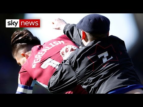 Watch the moment Aston Villa captain Jack Grealish is punched by Birmingham City fan