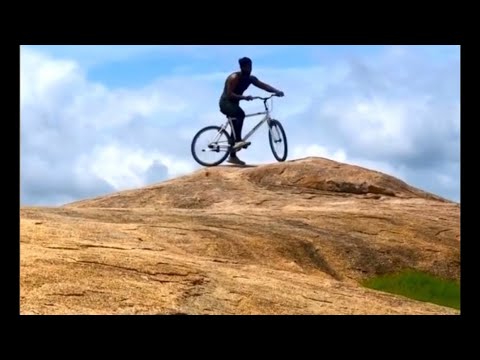 Mohan R Cycling stunt in mountain 