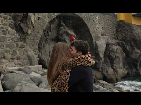 Couple kissing by the sea