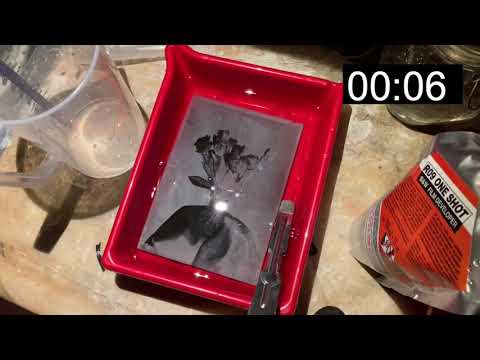 Developing negative film at infrared and fixing in visible light