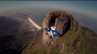 Wingsuit gliding over Pedra da Gávea in Rio de Janeiro