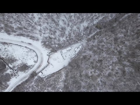 Home Comfort Camping in a Wood Stove Caravan During Heavy Snowfall