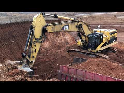 Caterpillar 365C Excavator Loading Trucks