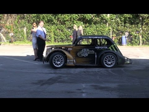 Terry Grant shows off his stunt driving skills at Vospers, the Human figure of eight