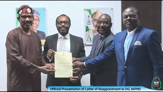 Presentation of Letter of Reappointment to Dr Obi 
