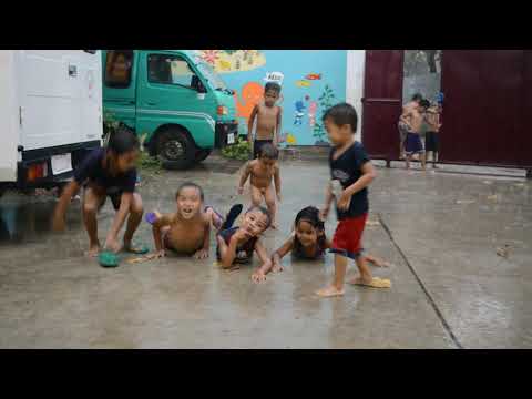 Slum kids playing in the Rain