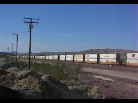 USA: A long freight train passing westbound through Barstow (San Bernardino County, California)