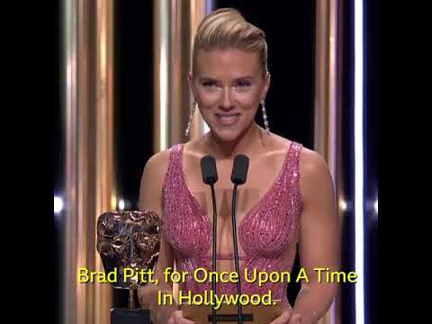 Margot Robbie accepts the BAFTA for Brad Pitt.