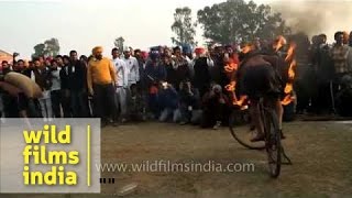 Riding a bicycle with burnt wheel - Kila Raipur, Punjab