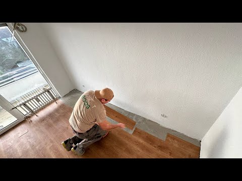 Vinyl kleben / erste & letzte Reihen ausschneiden / Vinylboden an der Heizing ausschneoden.