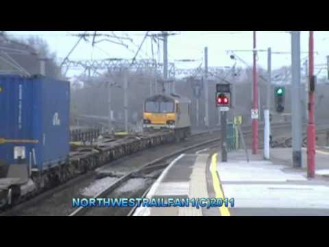 Ews class 92022 flying pass wigan north western working (4m63) intermodal train on the 15/03/2011