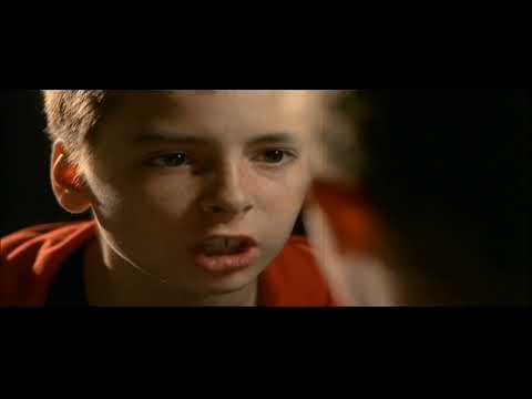 Millions film trailer still: Damien by the railway tracks with a cardboard box