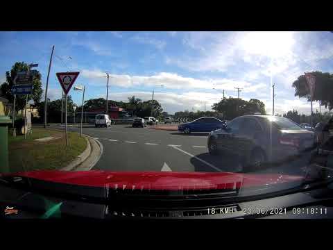 Close call for cyclist at roundabout