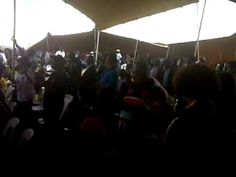 Crowds sing a Mandela praise song after Jacob Zuma's speech