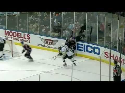 Tim Wallace runs over Paul Martin
