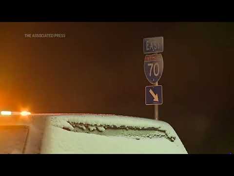 Snow blankets Denver, closes roads