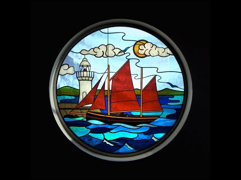 Brixham sailing fishing trawler Pilgrim and Brixham breakwater lighthouse