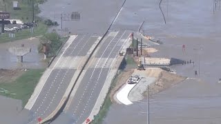 Floodwaters rise above highway signs in Missouri