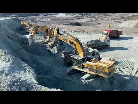 Caterpillar 385C And Caterpillar 352F Excavators Loading Trucks On The Line With Liebherr 974