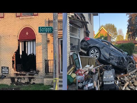 Car drives through Detroit house in crash on east side