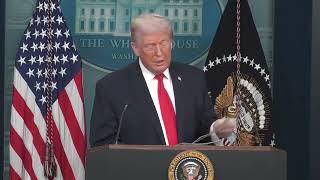 Donald Trump shows off mugshots during unhinged press conference