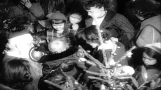 A man dressed as Santa Claus arrives in a helicopter and then in a sleigh to meet...HD Stock Footage