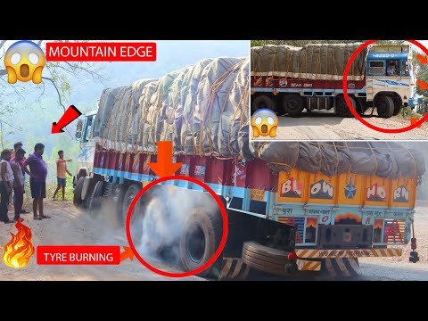 Heavy loaded Long Truck Wheels Spinning Truck Driver Difficulty to Drive in Ghat Road Hair Pin Curve