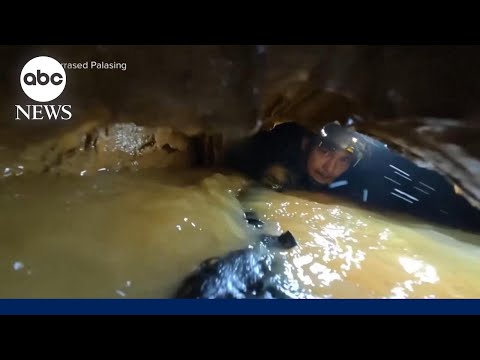 Laos cave rescuers hear 'knocking' in race to find last two trapped villagers