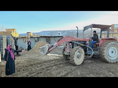 Tidying up in front of the cottage; when peace returned to Narges' house