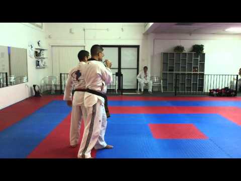 Wrist Grab Defense:  Arc Hand Strike then Wrist Lock
