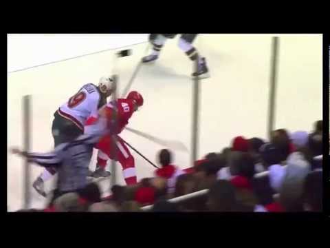 Double Tough - Henrik Zetterberg hard nose play along to boards gets the fans on their feet