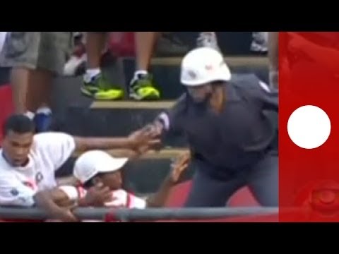 Brazil football violence: Fans brawl in stadium, clash with cops