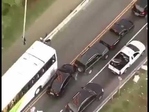 Police chase a reckless driver on the highway full of traffic