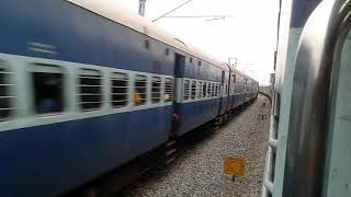 preview picture of video 'High speed single line crossing: Mumbai LTT Coimbatore Express in action'