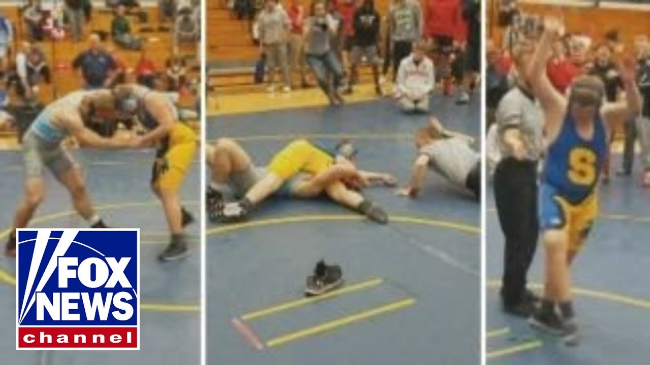 Wrestling manager with Down syndrome wins first-ever match