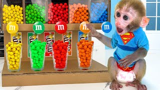Monkey Baby Bon Bon eats m&m chocolate candy with ducklings and clean the toilet