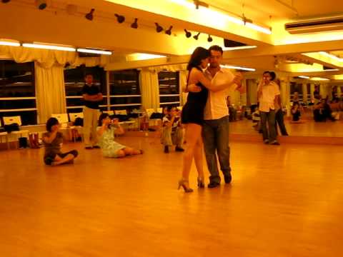  Pablo Martin Giorgini  and  Noelia Coletti  are  dancing  to  the  tango  "  Pan Comido  "