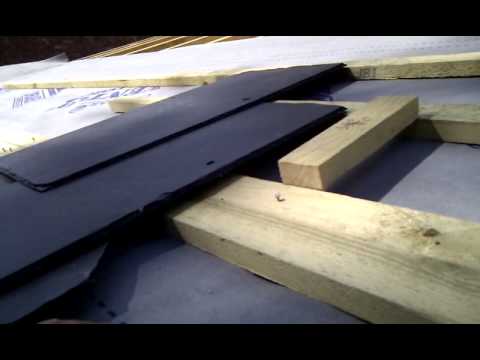 setting out the first row of slates on a pitched roof