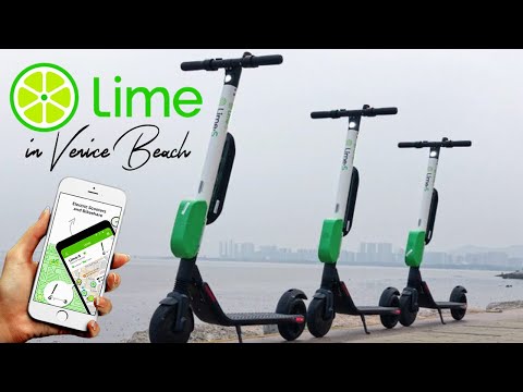 Riding the scooter lime-S in Venice Beach