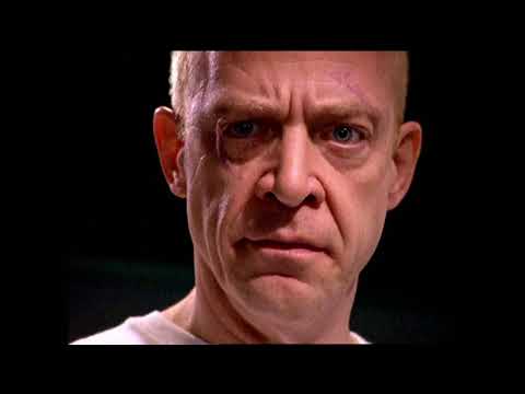 HBO’s Oz red-band trailer still — Augustus Hill’s narration over razor-wire imagery that set the series’ musical tone