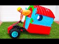 Children play and repair a playhouse
