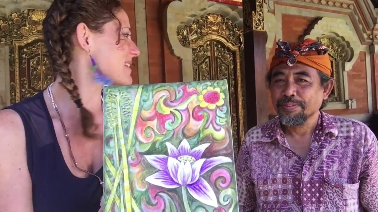 A traveler participates in a Balinese Painting Workshop.